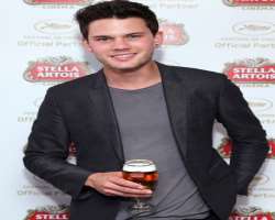 Jeremy Irvine consuming alcohol